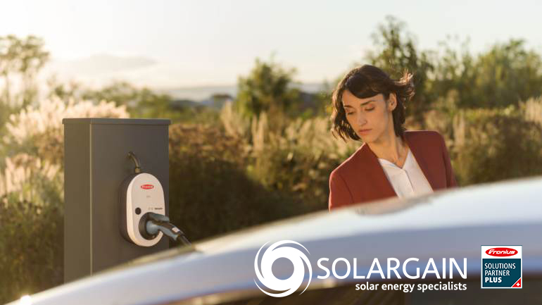 Woman charging car with Fronius Wattpilot